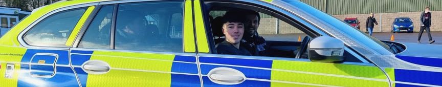 Saxon driving a Gloucestershire Police BMW Car